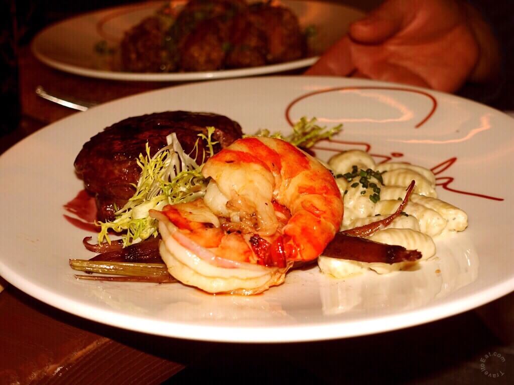 Surf and Turf 7oz Filet with Two Large Prawns, Port Wine Sauce, Creamy Gorgonzola Gnocchi and Baby Carrots. Giada Restaurant, Las Vegas