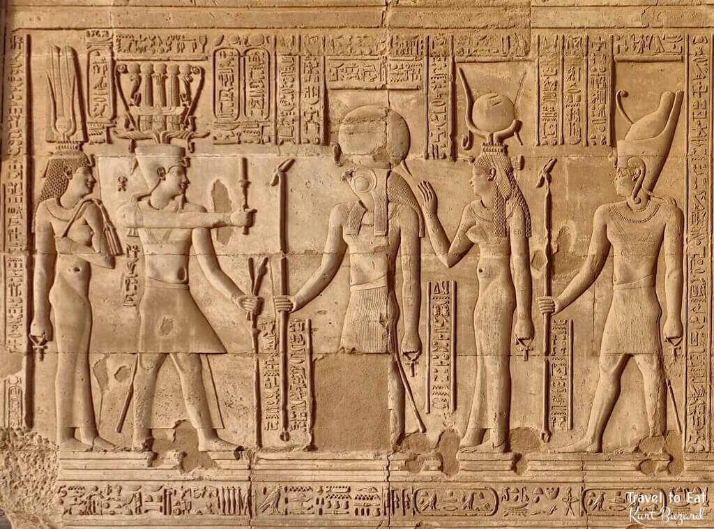 Cleopatra II Epiphanes (left), Ptolemy VI Philometor (right) and Ptolemy VIII Euergetes II Facing Haroeris and His Consort Ta-Sent-Nefer,. Kom Ombo Temple Egypt