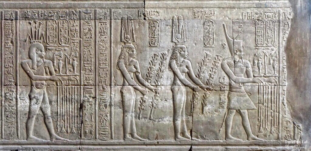 Ptolemy VIII Euergetes II, Backed by his two Wives Cleopatra II and Cleopatra III Precede Hapi. Kom Ombo Temple Egypt