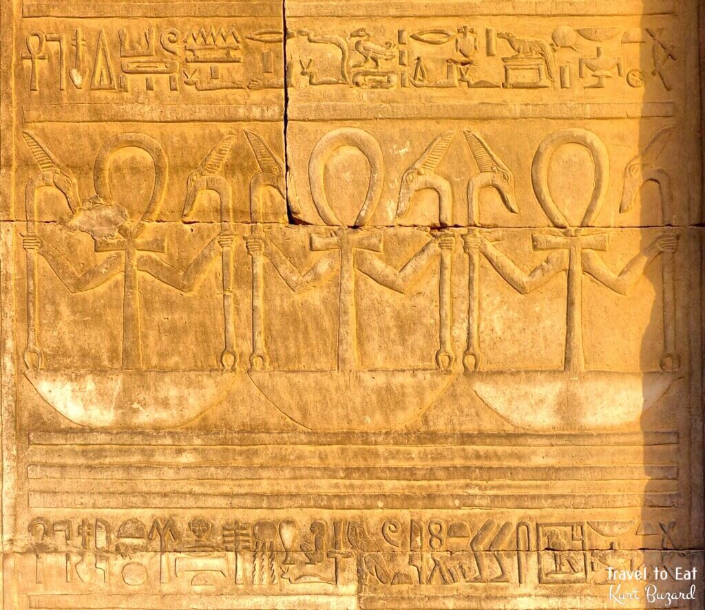Scepter of Thoth (Tcham or Was scepters with Ankh with Arms Over a Basket or Neb). Kom Ombo Temple Egypt