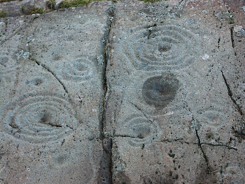 Cup and Ring Marks on a Stone near Cairnbaan Scotland. Wikipedia